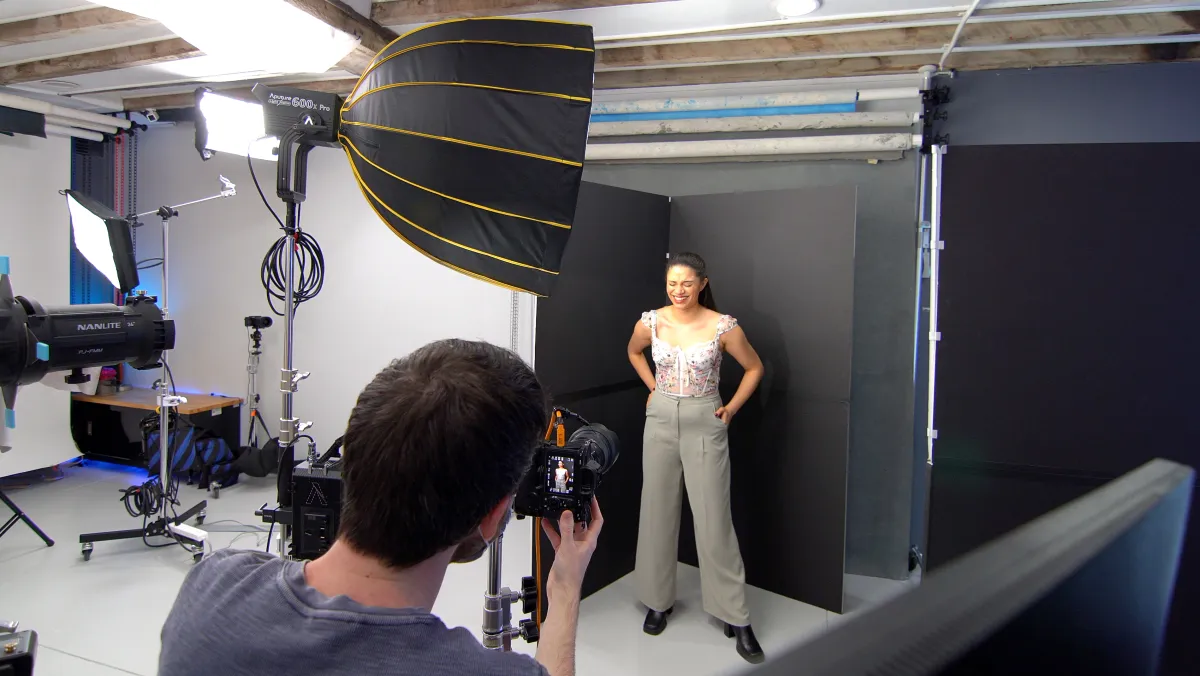 Behind the scenes of a professional headshot photography session in Philadelphia showing photographer directing a client during their shoot