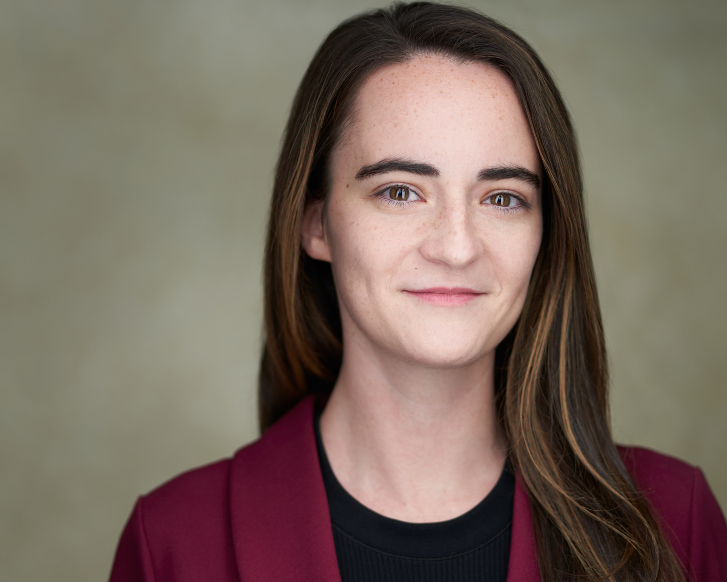 Resume Headshot smiling light background in blazer Resume Headshot smiling light background in blazer